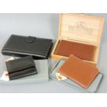 Three gentlemen’s leather wallets, by ‘The Craftsman’, a leather bound loose leaf diary/organiser, a