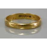 A 22ct gold wedding ring