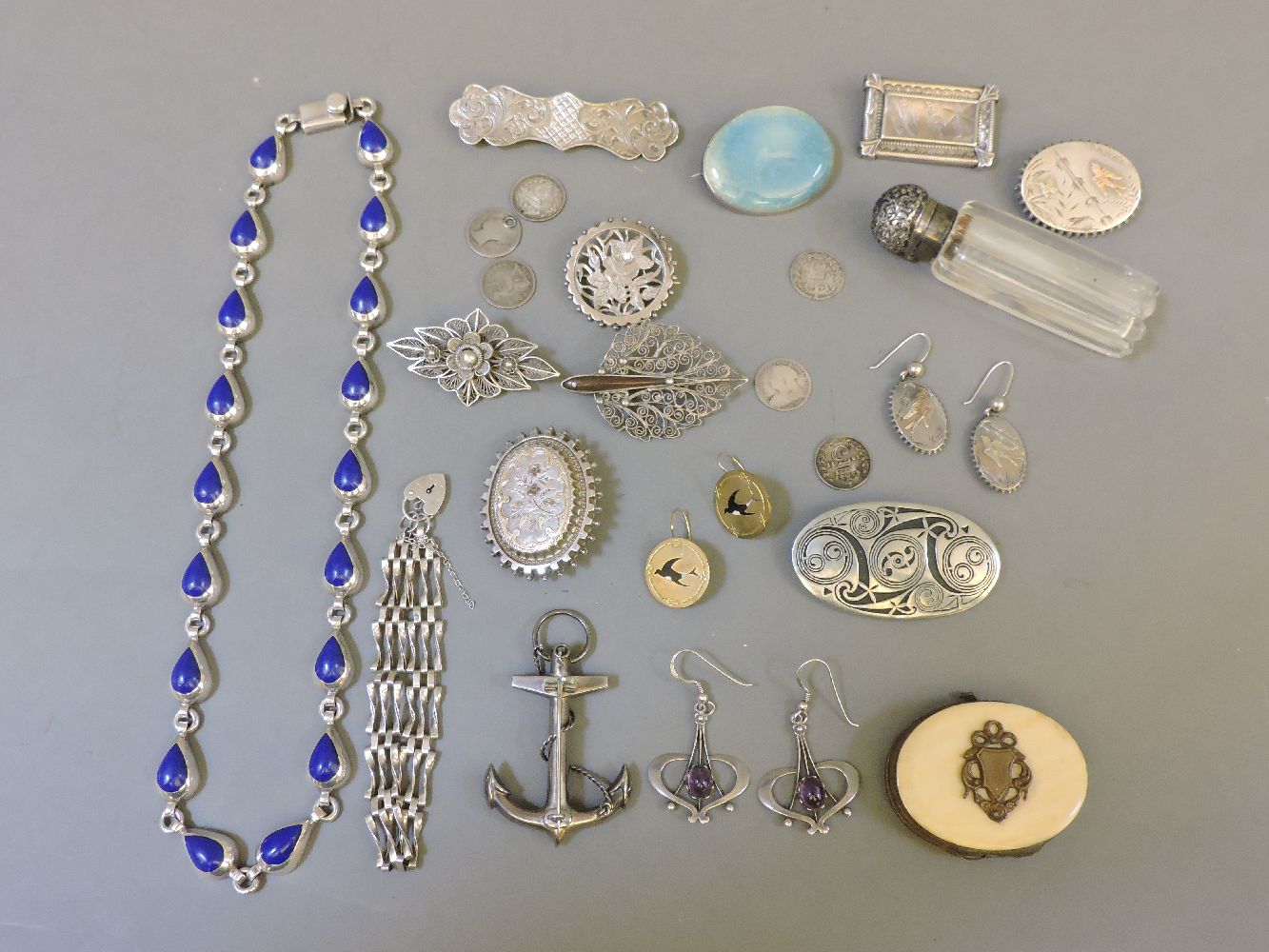 A Taxco Mexican silver necklace, a Ruskin plaque brooch, a silver Aesthetic movement brooch and