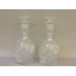 A pair of early 19th century cut glass decanters and stoppers, 25cm high