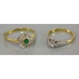 A single stone diamond ring, marked 18ct plat, and an 18ct gold emerald and diamond cluster ring