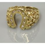 A 9ct gold gentleman's diamond set horse shoe ring