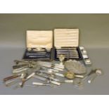 A box of silver and plate, including a cased manicure set, Iraqi silver, a niello compact, etc