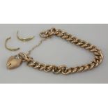 A gold hollow curb link chain bracelet, tested as approximately 9ct gold, and a 9ct gold wedding