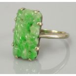 A carved jade plaque ring, tested as approximately 9ct white gold