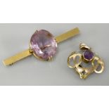 An Art Nouveau gold amethyst pendant, and an amethyst bar brooch marked 9ct