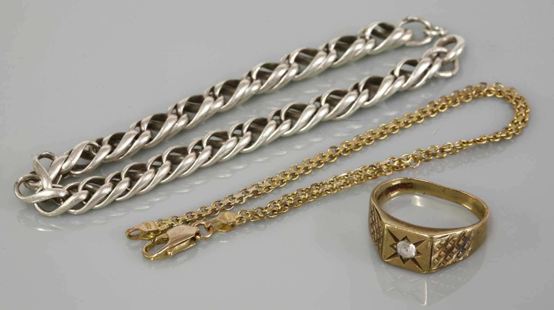 A gentleman's 9ct gold synthetic spinel ring, a 9ct gold Bismark bracelet, and a silver bracelet