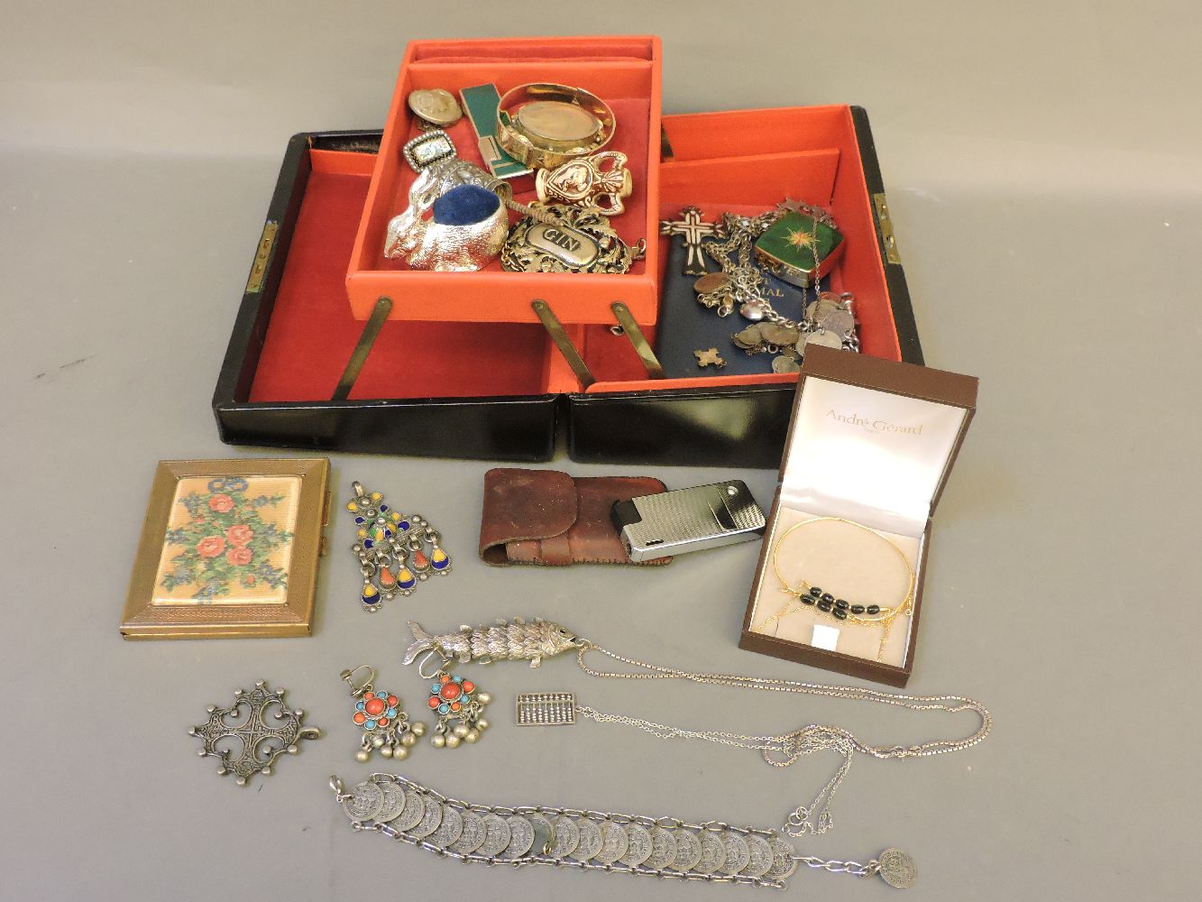 A jewellery box and contents, including silver items of jewellery