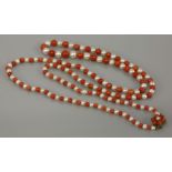 A single row graduated cultured pearl and coral necklace, with a 9ct gold cultured pearl and coral