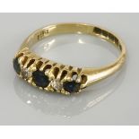 An Edwardian 18ct gold sapphire and diamond boat shaped ring