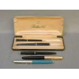 A Parker 61 fountain pen, a Parker 51 fountain pen, and three further pens