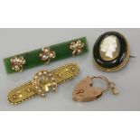 An Etruscan style split pearl gold bar brooch, marked 15ct, a nephrite jade split pearl gold bar