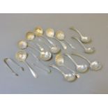Fourteen small silver sifter spoons, mostly late 19th/early 20th century, and two pairs of silver