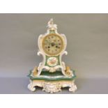 A late 19th century Jacob Petite porcelain painted and gilded clock and stand, the top restored,