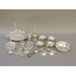 Silver items, to include a toast rack, marks rubbed, pair of horn knife rests, cruet items, 17th