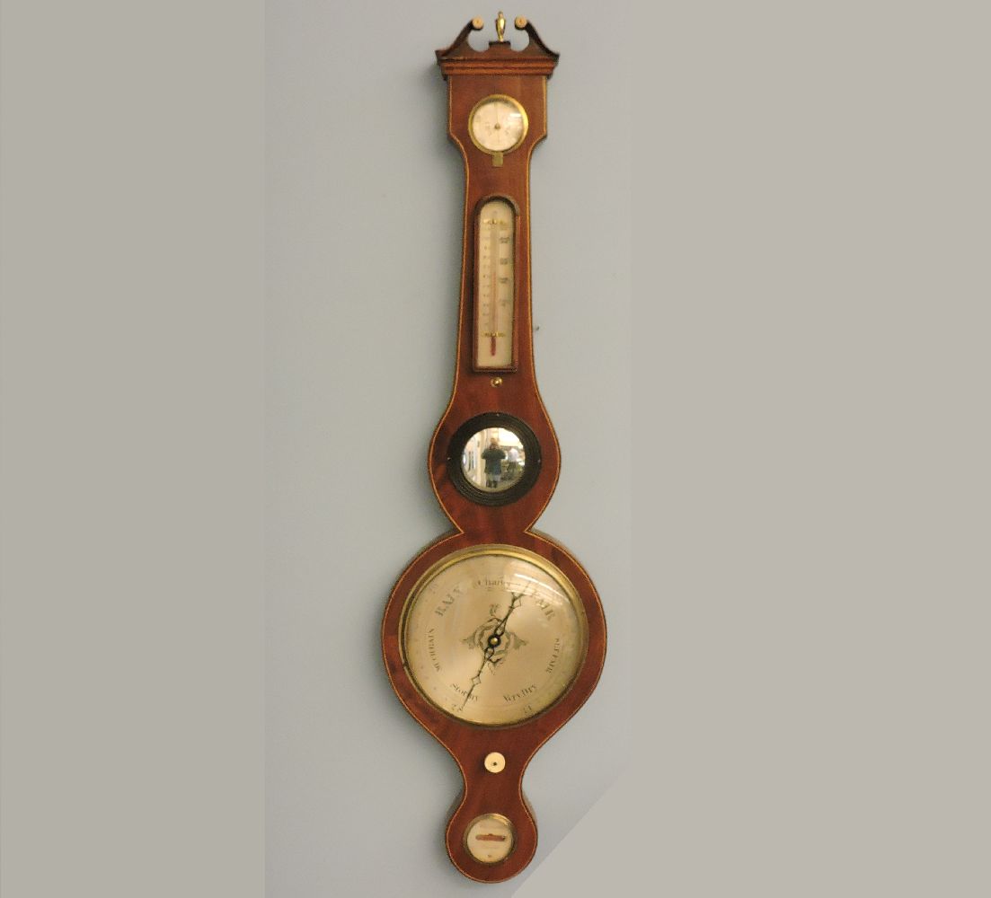 A strung mahogany wheel barometer, 97cm high
