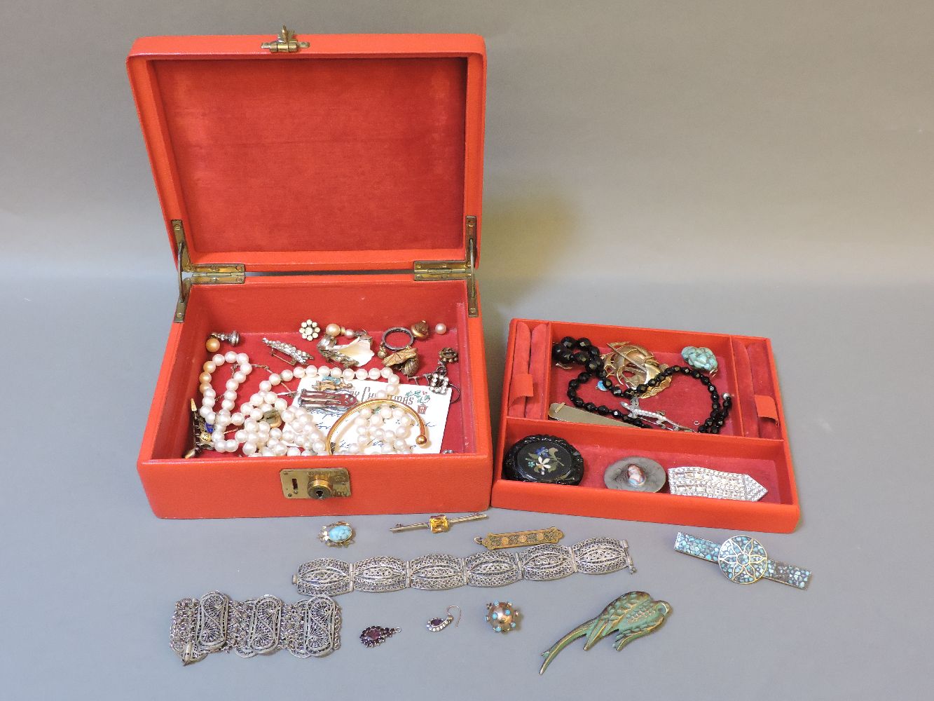 A red jewellery box and contents, including a 9ct gold penknife, etc