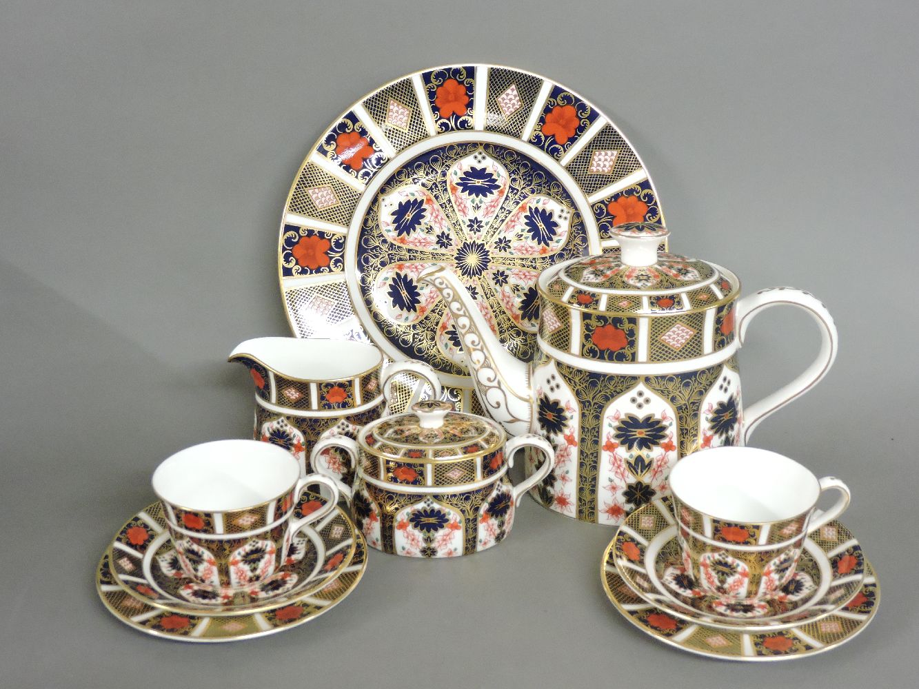 A Royal Crown Derby 'Old Imari' pattern two place teaset, comprising teapot, milk jug, sugar box,
