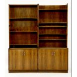 A pair of Danish rosewood cabinets,each with shelves above a cupboard,80cm wide43cm deep187cm