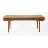A Danish teak coffee table,with drawers to each end,140cm wide55cm deep53.5cm high
