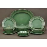 A Wedgwood green pottery dinner service,designed by Keith Murray, for six place settings, each