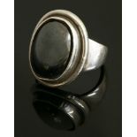 A sterling silver haematite ring,by Georg Jensen, No. 46A, 'Moonlight Blossom' designed by Harald