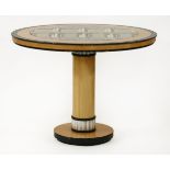 A centre table,designed by Piero Fornasetti, the centre with a lacquered architectural design,