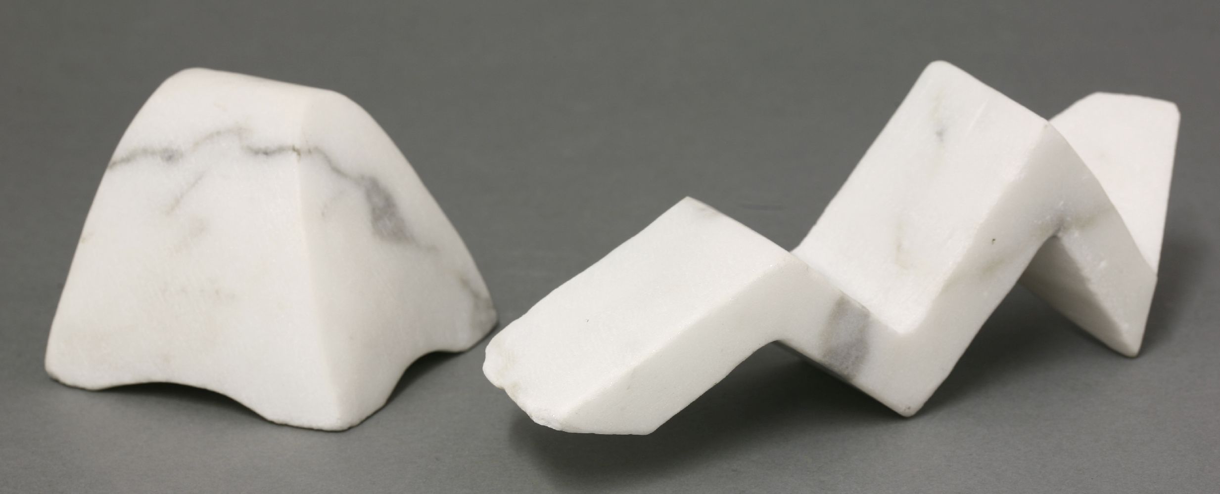 Agneta Stening (b.1954),two forms, white marble, signed with monogram,8 and 17cm long