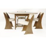 An oak dining table and four chairs,by E Gomme of High Wycombe,138.5cm wide88cm deep73cm high (5)