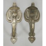 A pair of silver-plated brass wall lights,each with a single light on a scrolled arm,32.5cm high (