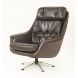 A Danish swivel armchair,in brown leather