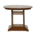 An Art Deco walnut and rosewood centre table,the oval top raised on an open stand and raised on a