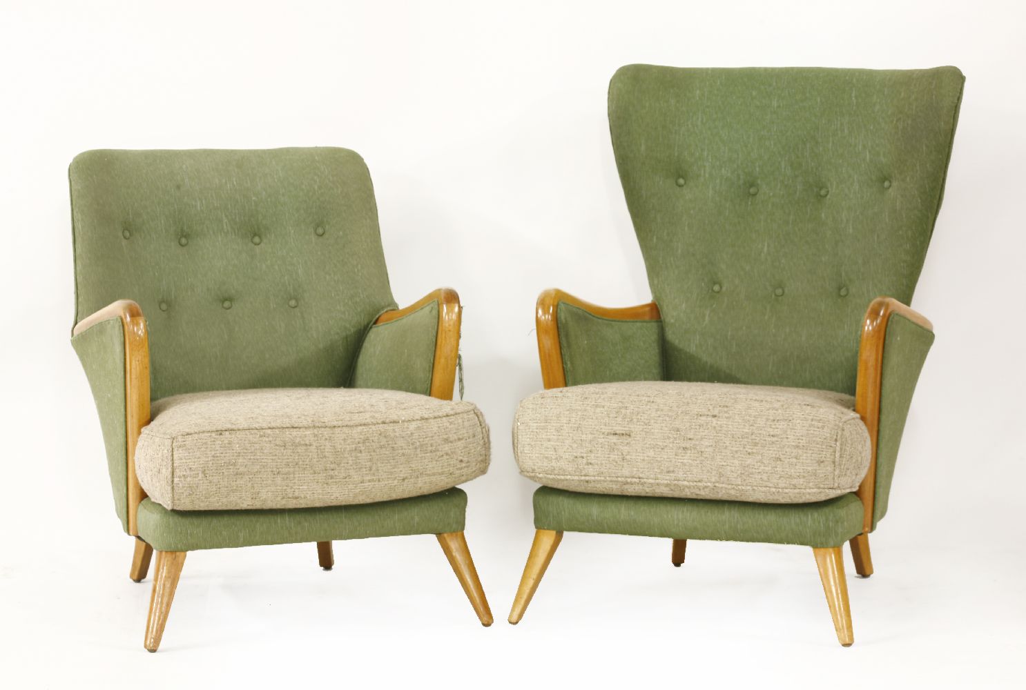 A 'Manston' suite,1950s, comprising a high back armchair, another, and a three-seater settee,