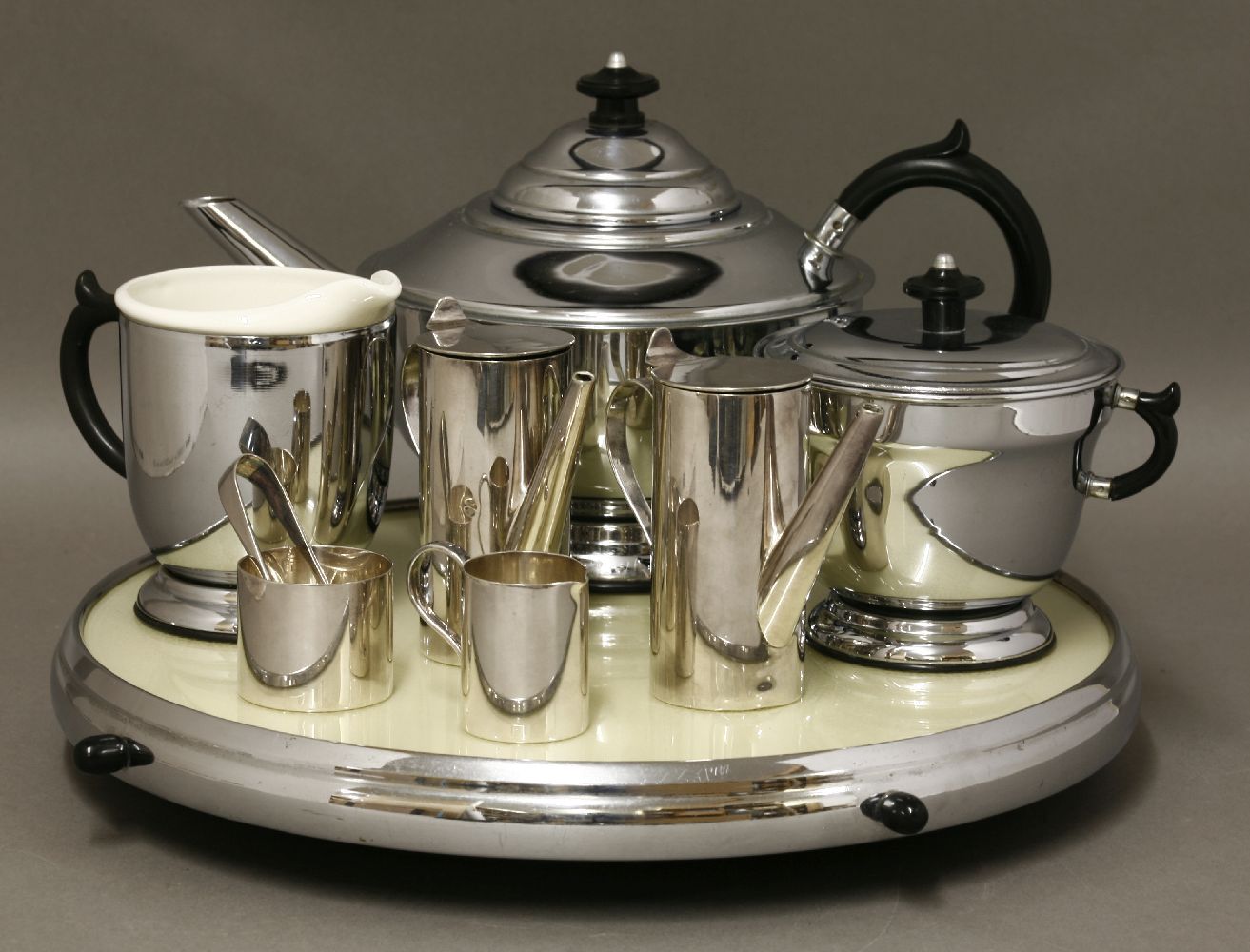 An Art Deco chrome and Bakelite three-piece tea set,on a lazy Susan stand,37cm diameter, anda Walker