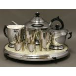 An Art Deco chrome and Bakelite three-piece tea set,on a lazy Susan stand,37cm diameter, anda Walker