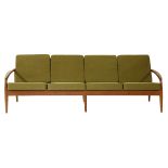 A teak four-seater settee,designed by Kai Kristiansen, with olive green upholstered seats and