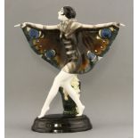 A Goldscheider pottery figure,'The Captured Bird', by Josef Lorenzl, hers arms outstretched, fingers