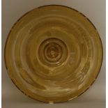 An amber glass dish,deeply engraved and etched with stylised floral designs, engraved 'H Delatte,