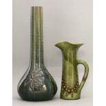 An Elton sunflower pottery vase,heavily potted, incised with a bearded iris in a green and blue