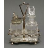 A silver plated four piece cruet,by Hukin & Heath, after a design by Dr Christopher Dresser