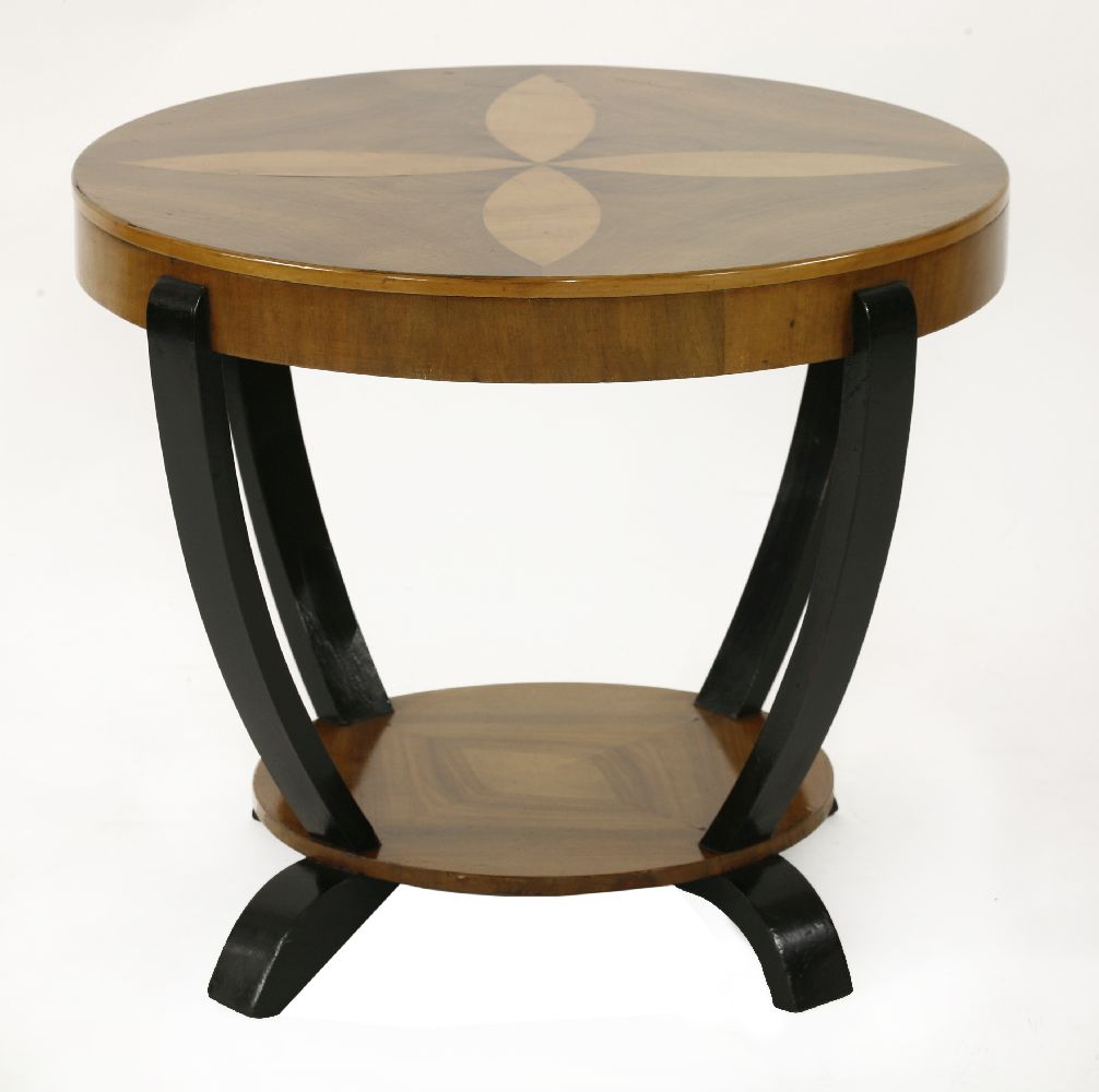 An Art Deco walnut inlaid circular coffee table,with ebonised strut supports and feet,57.5cm