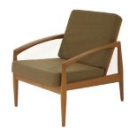 A teak armchair,designed by Kai Kristiansen, with a brown upholstered seat and back