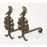 A pair of wrought iron chenets,after a design by Edgar Brandt, modelled as stylised peacocks,49cm