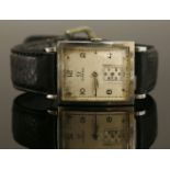 A gentlemen's stainless steel Omega mechanical strap watch, c.1945,a rectangular silvered dial