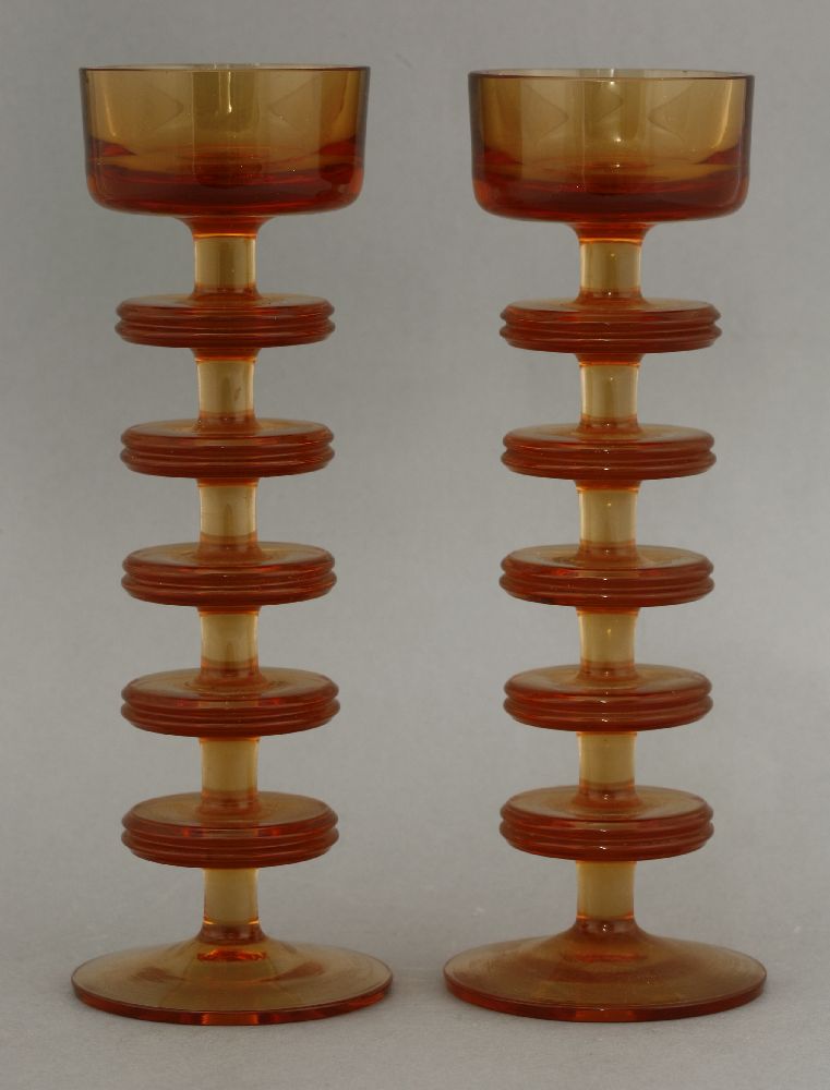 A pair of Wedgwood topaz glass Sheringham candlesticks,designed by Ronald Stennett-Wilson, pattern