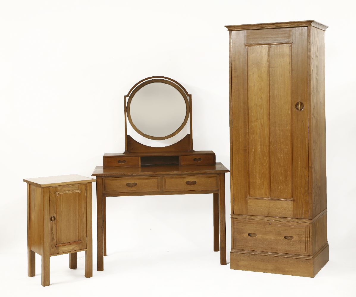A chestnut bedroom suite,designed by Sir Ambrose Heal in 1905-10, no. 392, comprising:a dressing