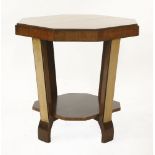 An Art Deco walnut table,with an undertier,61cm diameter60.5cm high