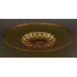 A Murano amber glass bowl,with a sunken centre,35.5cm diameter
