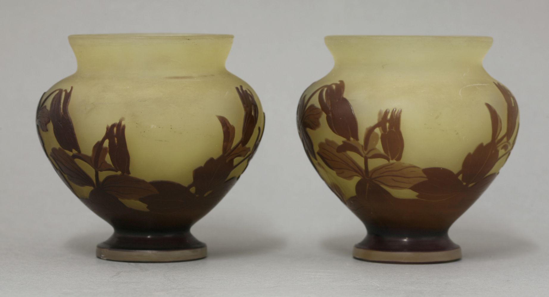 A pair of Gallé cameo glass vases,in amber and polished purple glass in the form of flowers, - Image 3 of 3