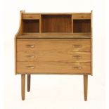 A Danish teak desk/dressing table,with drawers and a pull-out surface,82cm wide45cm deep101.5cm